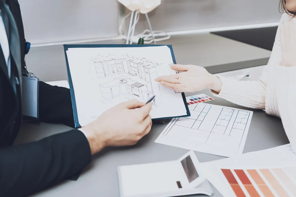 Close,Up,Manager,In,Suit,Is,Showing,Blueprints,To,Female Close,Up,Manager,In,Suit,Is,Showing,Blueprints,To,Female